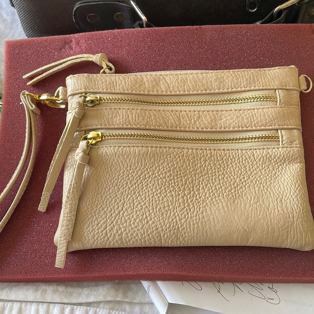 NWOT Leather 4 zipper compartments. Beige you  can add chain.